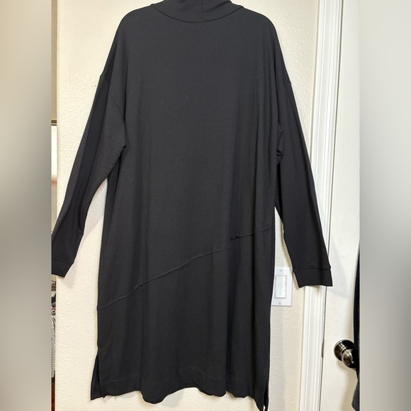 Lisa Bayne Chic Black Long Sleeve Dress with Pockets and Asymmetric Design. - Picture 8 of 14